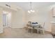 Carpeted dining area with traditional chandelier at 2280 Andover Dr. # L, Surfside Beach, SC 29575