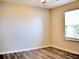 Clean, empty bedroom with a ceiling fan and a window at 230 Vermillion Dr., Little River, SC 29566