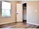 Bedroom with wood floors, a window, and closet space at 230 Vermillion Dr., Little River, SC 29566