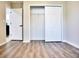 Bedroom with wood floors and a closet with sliding doors at 230 Vermillion Dr., Little River, SC 29566
