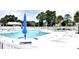 Sparkling community pool with comfortable lounge chairs and umbrellas at 230 Vermillion Dr., Little River, SC 29566