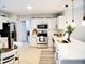 Modern kitchen with white cabinets, stainless steel appliances, subway tile backsplash and island seating at 230 Vermillion Dr., Little River, SC 29566