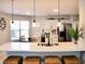 Eat-in kitchen featuring stainless appliances, white cabinets, breakfast bar and lots of natural light at 230 Vermillion Dr., Little River, SC 29566
