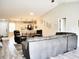 Open-concept living space with hardwood floors connecting the living room and eat-in kitchen at 230 Vermillion Dr., Little River, SC 29566
