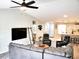 Open concept living space with hardwood floors and high vaulted ceilings, connecting eat-in kitchen at 230 Vermillion Dr., Little River, SC 29566