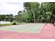 Outdoor pickleball court with a well-maintained surface and surrounding greenery at 230 Vermillion Dr., Little River, SC 29566