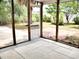 A screened-in porch with an outdoor view, enhancing indoor-outdoor living at 230 Vermillion Dr., Little River, SC 29566