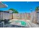Backyard featuring a wooden fence and deck, with a garden hose and AC unit at 2309 Withers Dr. # 4, Myrtle Beach, SC 29577