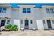 Exterior shot of a white townhome featuring a gated entryway and classic architectural details at 2309 Withers Dr. # 4, Myrtle Beach, SC 29577