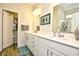 Bathroom features a double sink vanity, framed mirrors, and modern lighting fixtures at 234 Rolling Woods Ct., Little River, SC 29566