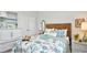 Bedroom featuring a wicker headboard and blue accents, creating a serene space at 234 Rolling Woods Ct., Little River, SC 29566