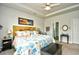 Well-lit bedroom features a charming headboard and a comfortable queen-size bed at 234 Rolling Woods Ct., Little River, SC 29566