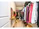 Walk-in closet with hanging racks, shelving, and an organized storage system at 234 Rolling Woods Ct., Little River, SC 29566