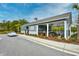 Charming clubhouse with inviting outdoor seating and beautifully landscaped surroundings at 234 Rolling Woods Ct., Little River, SC 29566