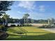Scenic pool area with comfortable seating and lush landscaping, perfect for relaxation at 234 Rolling Woods Ct., Little River, SC 29566
