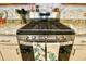 Close up of a modern stainless steel gas range in a well-equipped kitchen at 234 Rolling Woods Ct., Little River, SC 29566
