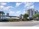 A relaxing and scenic view of a resort building with palm trees, street access, and lush landscaping for all vacationers at 2401 S Ocean Blvd. # 557, Myrtle Beach, SC 29577