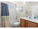 Cozy bathroom with a shower-tub combo, a single sink vanity and updated fixtures and hardware at 2487 Windmill Way, Myrtle Beach, SC 29579