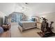 Attic bedroom with sloped ceilings features a cozy bed, built-in shelves, and an exercise bike at 2487 Windmill Way, Myrtle Beach, SC 29579