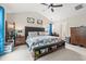 Bright bedroom with vaulted ceiling, ceiling fan and a decorative bench at the foot of the bed at 2487 Windmill Way, Myrtle Beach, SC 29579