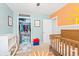 Charming Bedroom features whimsical sun and moon wall decor, a gray crib, and an organized closet at 2487 Windmill Way, Myrtle Beach, SC 29579