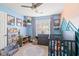 Bright Bedroom features fun decor, a comfortable chair, alphabet rug, and a window with natural light at 2487 Windmill Way, Myrtle Beach, SC 29579