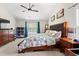 Large main bedroom features a ceiling fan and plenty of natural light from a large window at 2487 Windmill Way, Myrtle Beach, SC 29579