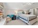 Bright attic bedroom features a comfy bed, storage shelves, and an exercise bike at 2487 Windmill Way, Myrtle Beach, SC 29579