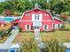 Community clubhouse with red barn style building and pool at 2487 Windmill Way, Myrtle Beach, SC 29579