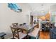 Open dining area with hardwood floors adjacent to the kitchen and living spaces at 2487 Windmill Way, Myrtle Beach, SC 29579