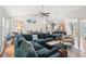 Open-concept living room with a comfortable sectional couch and hardwood floors at 2487 Windmill Way, Myrtle Beach, SC 29579