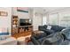 Cozy living room with hardwood floors, a plush couch, and natural light at 2487 Windmill Way, Myrtle Beach, SC 29579