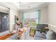 Inviting playroom filled with natural light, a table set, and play area with a gray toddler couch at 2487 Windmill Way, Myrtle Beach, SC 29579