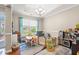 Bright playroom featuring a table, play area, and toy kitchen, with natural light streaming through the window at 2487 Windmill Way, Myrtle Beach, SC 29579