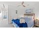 A bright bedroom featuring a comfortable bed with blue bedding and coastal decor for a relaxing stay at 2710 S Ocean Blvd. # 402, Myrtle Beach, SC 29577