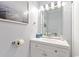 Clean powder room, featuring a white vanity and stylish mirror with modern lighting fixtures at 2710 S Ocean Blvd. # 402, Myrtle Beach, SC 29577
