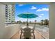 Relaxing covered patio with ocean views, outdoor seating, and sunny beach breezes at 300 N Ocean Blvd. # 122, North Myrtle Beach, SC 29582