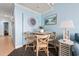 Cozy dining nook with wooden table and chairs, adjacent to the living area, providing a pleasant space to eat at 300 N Ocean Blvd. # 122, North Myrtle Beach, SC 29582