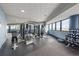 Well-equipped fitness center with weight machines, dumbbells, and scenic window views at 300 N Ocean Blvd. # 122, North Myrtle Beach, SC 29582