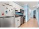 Efficient kitchen with white cabinets, stainless steel appliances, and granite countertops, perfect for a vacation at 300 N Ocean Blvd. # 122, North Myrtle Beach, SC 29582