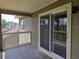 Balcony with wooded views, sliding door access, and ample light at 300-J Myrtle Greens Dr. # J, Conway, SC 29526