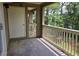 Relaxing balcony with wooded views, a door, and railing for outdoor enjoyment at 300-J Myrtle Greens Dr. # J, Conway, SC 29526