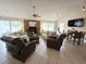 Spacious living room with fireplace, comfortable seating, and tile flooring at 300-J Myrtle Greens Dr. # J, Conway, SC 29526