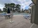 Community pool with lounge chairs at 300-J Myrtle Greens Dr. # J, Conway, SC 29526