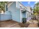Home's backyard features light blue siding and partial privacy fence at 308 76Th Ave. N # 5, Myrtle Beach, SC 29572