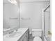 Bright bathroom featuring a sleek vanity, commode, and shower with glass door at 308 76Th Ave. N # 5, Myrtle Beach, SC 29572
