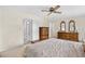 This primary bedroom boasts a ceiling fan and view to the attached bathroom at 308 76Th Ave. N # 5, Myrtle Beach, SC 29572