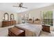 The bedroom features natural light from two windows, and wooden furniture at 308 76Th Ave. N # 5, Myrtle Beach, SC 29572