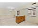 Dining area featuring tile flooring and a wood-look accent wall at 308 76Th Ave. N # 5, Myrtle Beach, SC 29572