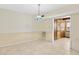 Dining room featuring tile flooring, a pendant light, and ample space at 308 76Th Ave. N # 5, Myrtle Beach, SC 29572